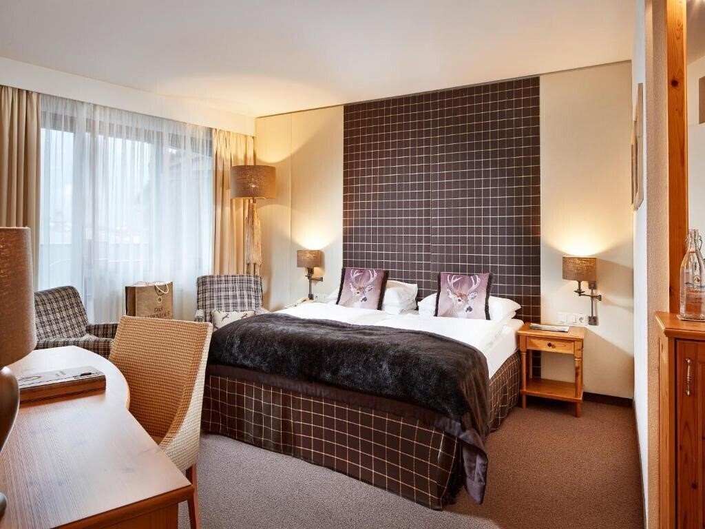 Апартаменты Das Alpenhaus Kaprun Hotel 4*