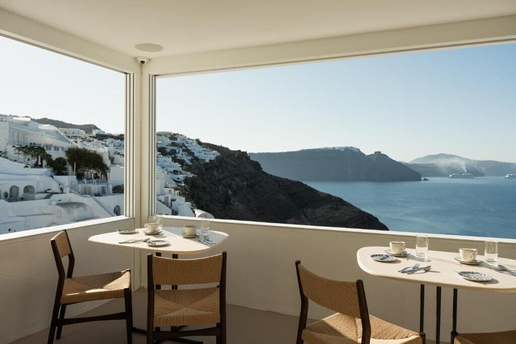 Панорама Canaves Oia Hotel Santorini 4*
