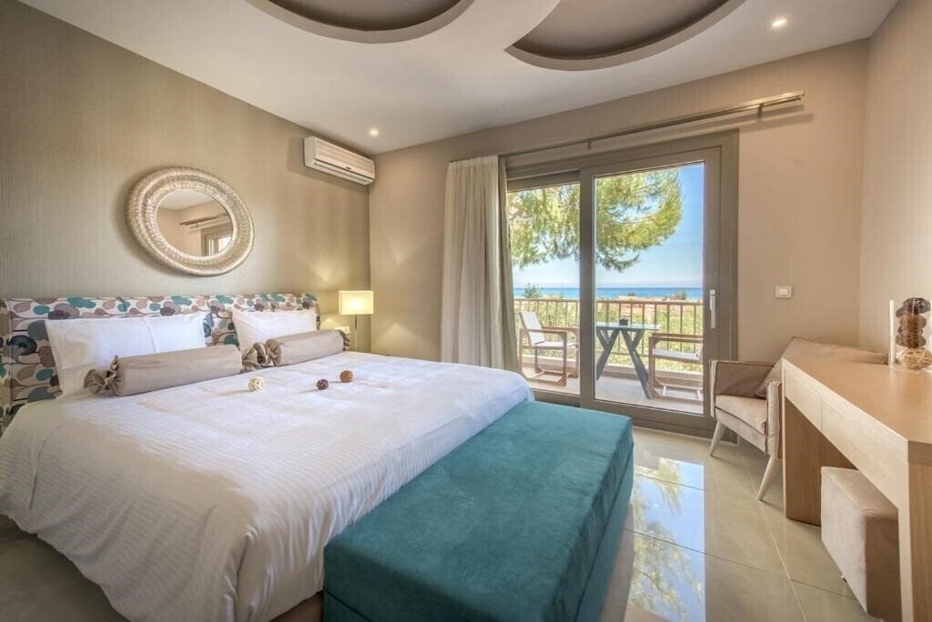 Отель Koukounaria Aparthotel & Villa 4*