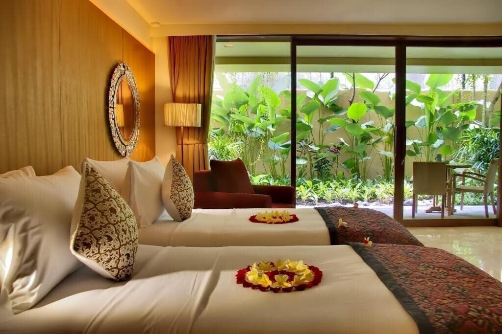 Фото Komaneka at Rasa Sayang 4*