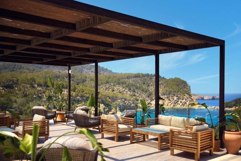 Фото The Club Cala San Miguel Hotel Ibiza, Curio Collection by Hilton 5*