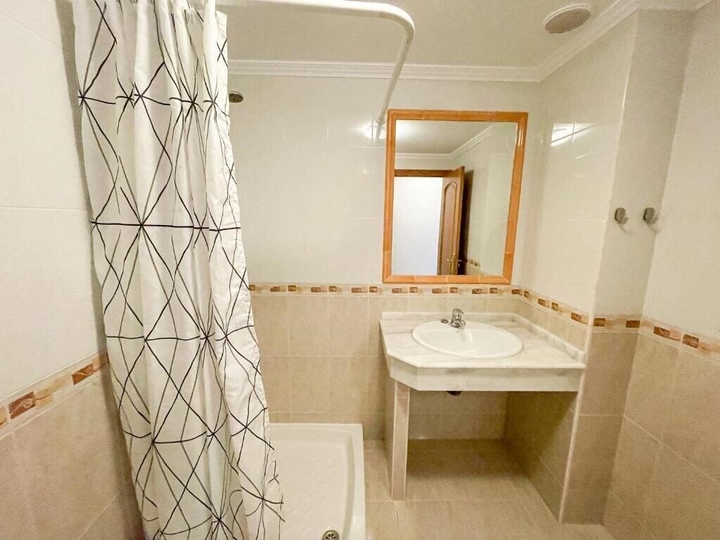 Фотографія Apartamentos Playa De La Lanzada 3000 3*