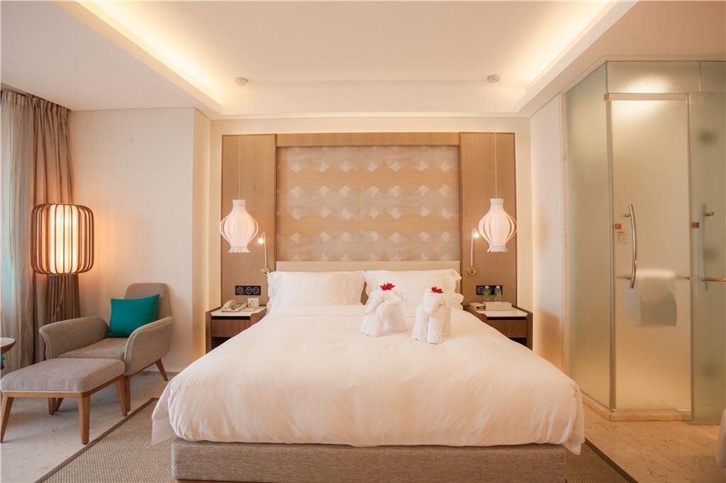 Апартаменти Phoenix Island Sanya 5*