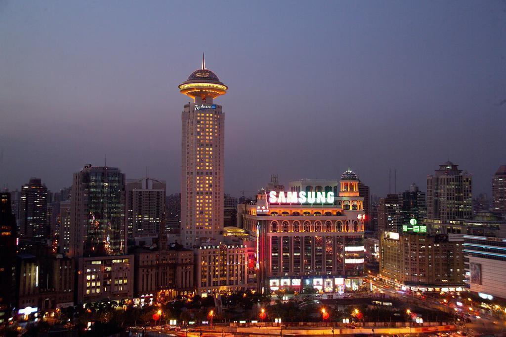 Готель Radisson Blu Hotel Shanghai New World 5*