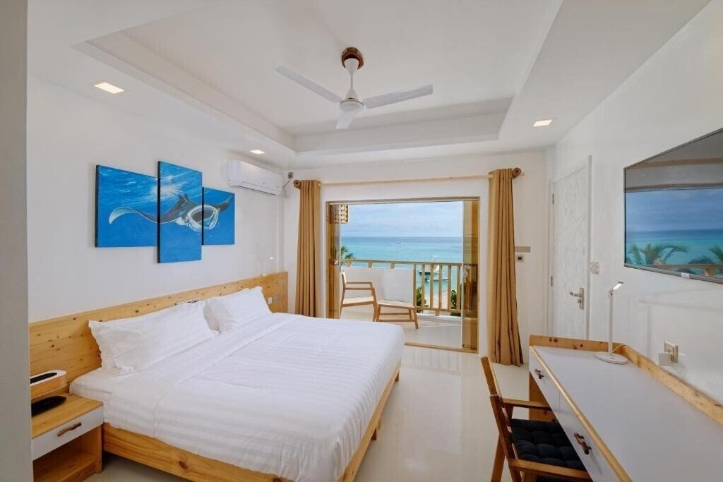 Вид Luau Beach Inn Maldives Guest House гостиный двор