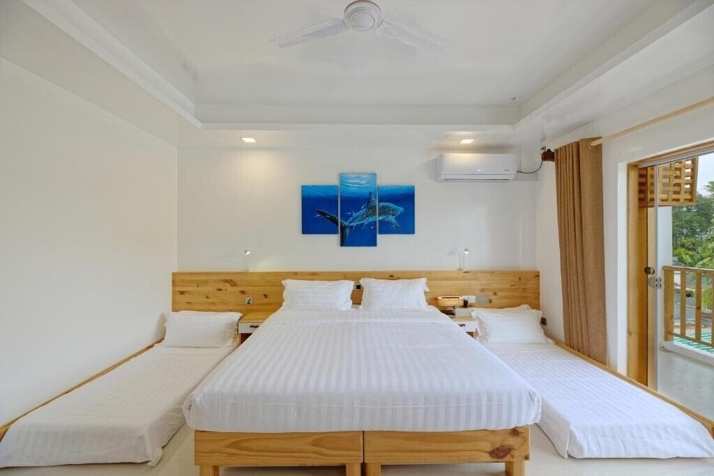 Апартаменты Luau Beach Inn Maldives Guest House гостиный двор