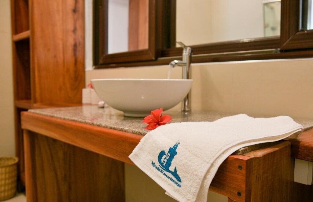 Фото Mnarani Beach Cottages 4*