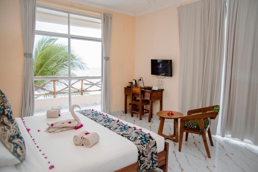 Фото Double A Nungwi Beach Hotel 4*