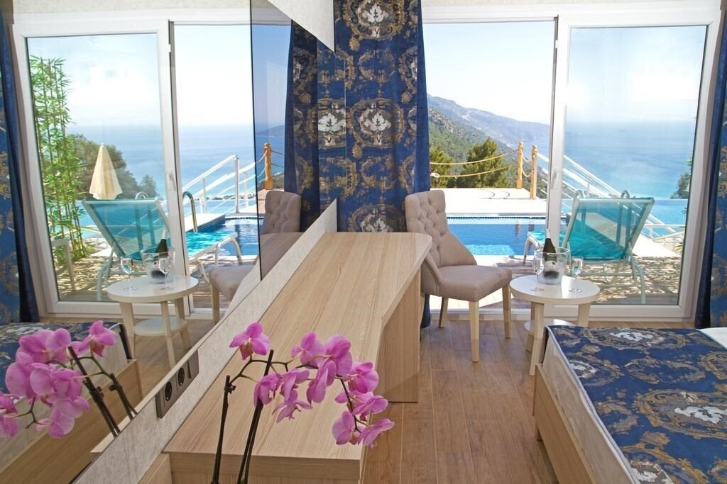 Фотографія Sertil Deluxe Hotel & SPA (ex. Tropical Suites by Sertil, Ramada by Wyndham Fethiye Oludeniz) 4*