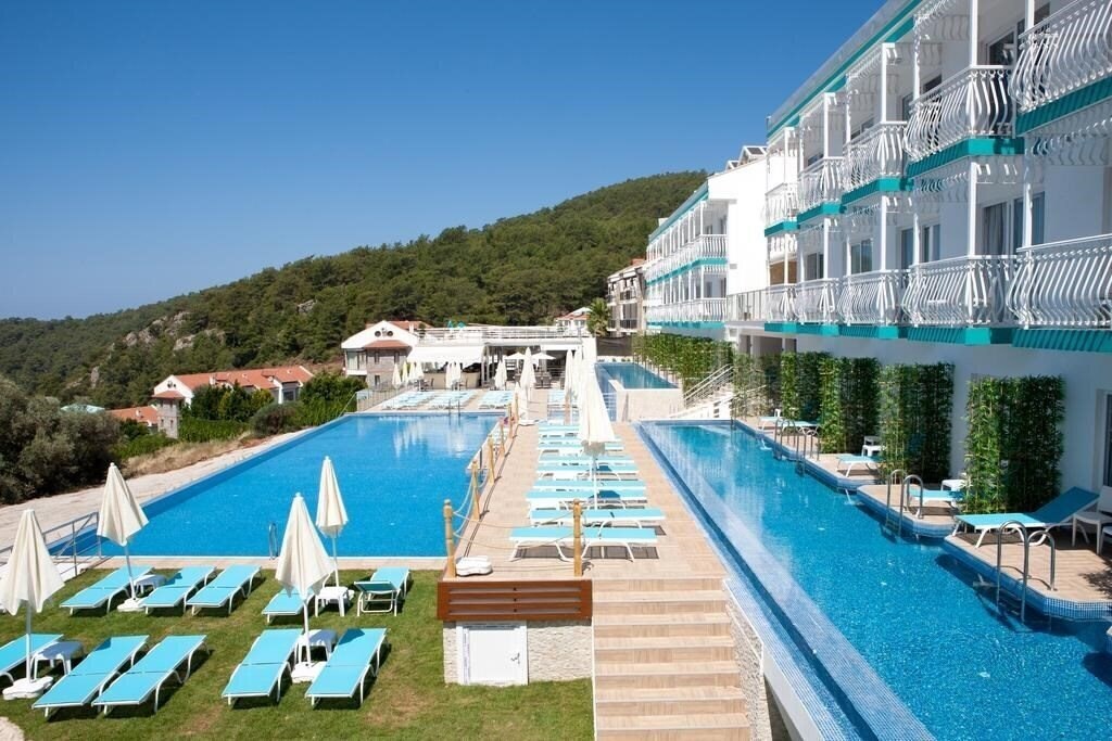 Готель Sertil Deluxe Hotel & SPA (ex. Tropical Suites by Sertil, Ramada by Wyndham Fethiye Oludeniz) 4*