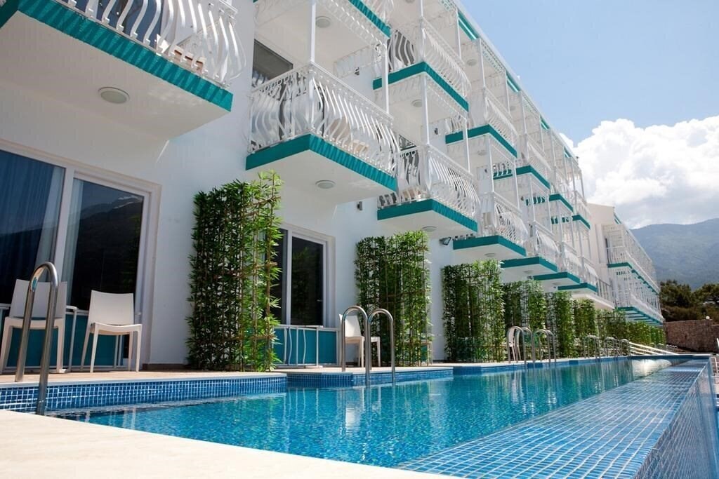 Апартаменти Sertil Deluxe Hotel & SPA (ex. Tropical Suites by Sertil, Ramada by Wyndham Fethiye Oludeniz) 4*